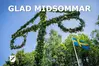 En midsommarstång och texten Glad midsommar